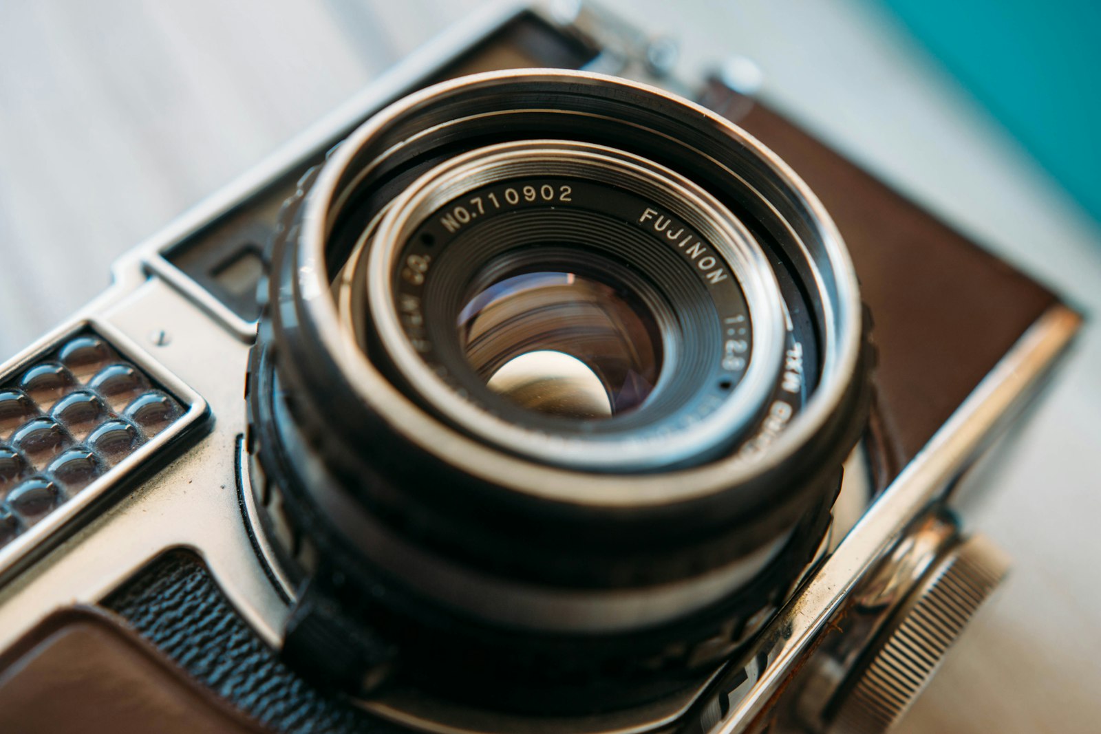 Close-up of a vintage rangefinder camera lens with a visible engraved serial number